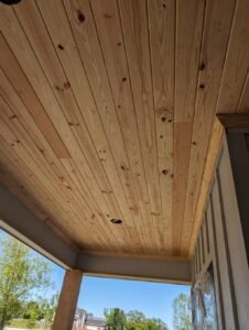 Newly installed tongue and groove pine ceiling with recessed lighting, adding warmth and elegance