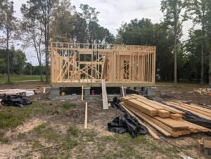 House on a pier and beam foundation, showcasing the early stages of construction.