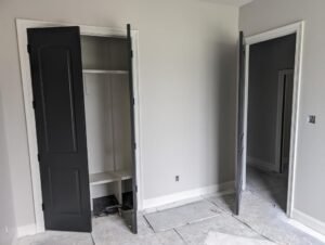 Elegant black closet doors and interior doors in a newly constructed home.