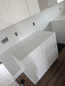Custom kitchen island installation in Lafayette, LA by WTH Construction.